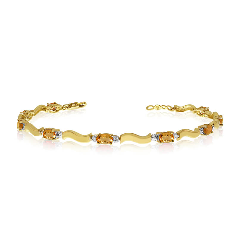 This 10K Yellow Gold oval citrine and diamond bracelet features nine 5x3 mm stunning natural citrine stones with a 2.07 ct total gem weight.