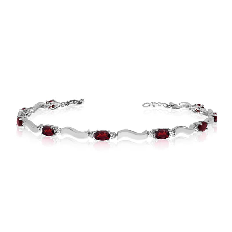 This 10K White Gold oval garnet and diamond bracelet features nine 5x3 mm stunning natural garnet stones with a 2.25 ct total gem weight.