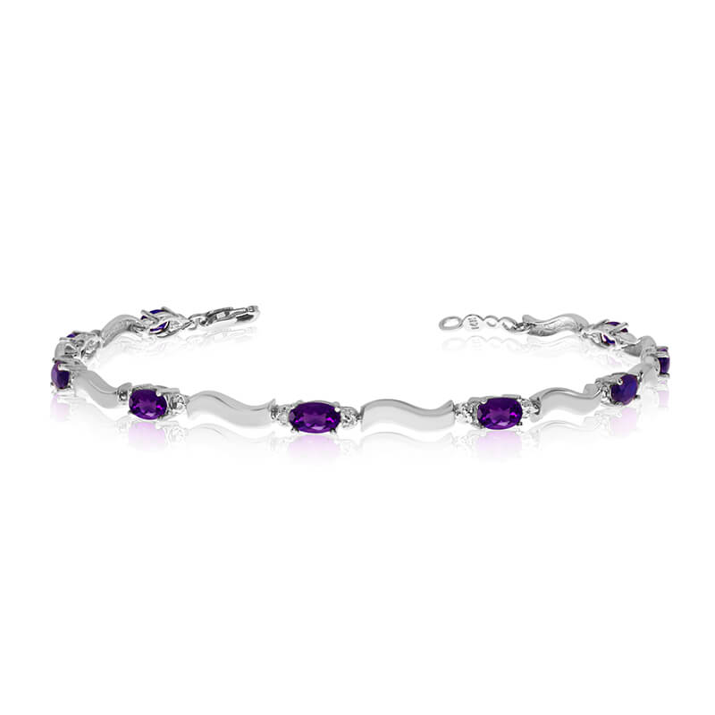 This 10K White Gold oval amethyst and diamond bracelet features nine 5x3 mm stunning natural amet...