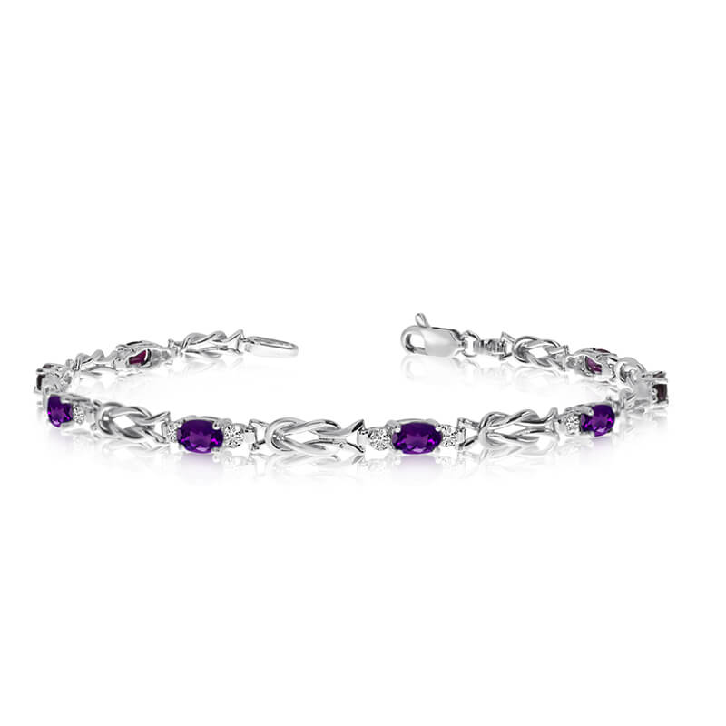 This 10K White Gold oval amethyst and diamond bracelet features eight 5x3 mm stunning natural ame...