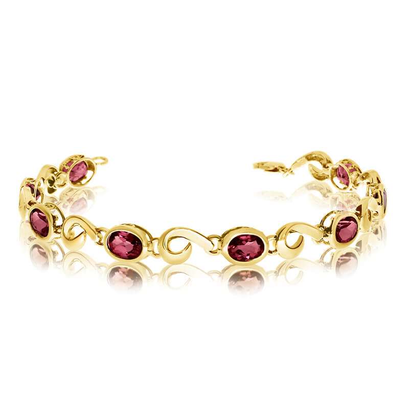 This 14k yellow gold oval garnet bracelet features 8 7x5 mm stunning natural garnet stones with a 5.6 ct total gem weight.