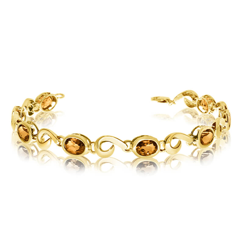 This 14k yellow gold oval citrine bracelet features 8 7x5 mm stunning natural citrine stones with a 5.12 ct total gem weight.