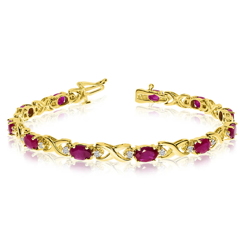 This 14k yellow gold natural ruby and diamond tennis bracelet features 11 oval rubys with a total...