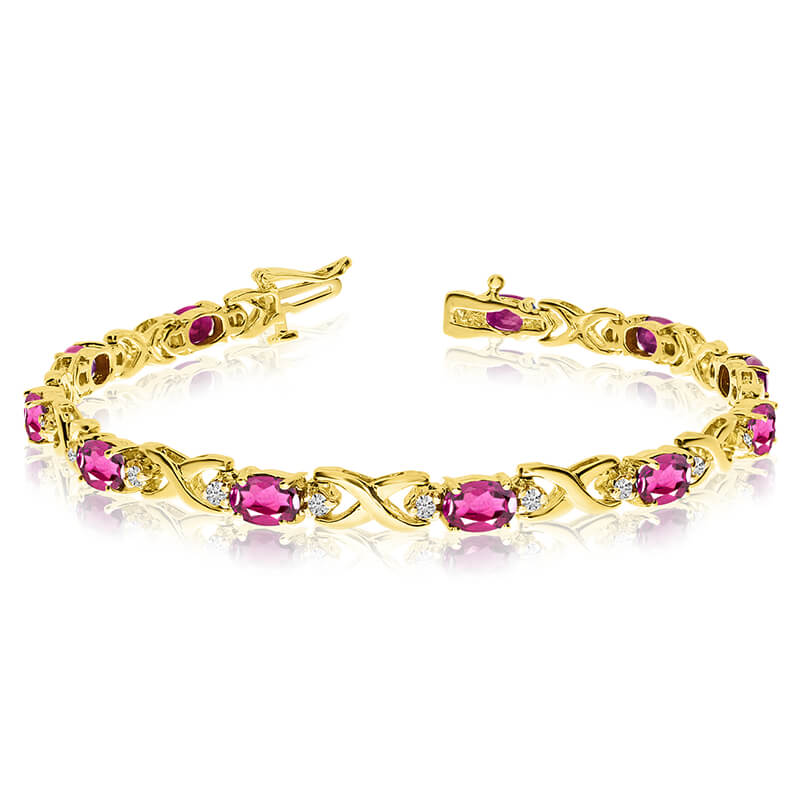 This 14k yellow gold natural pink-topaz and diamond tennis bracelet features 11 oval pink-topazs ...