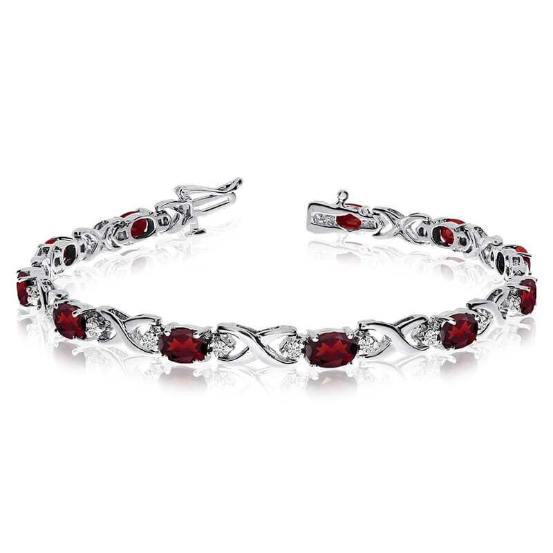 This 14k white gold natural garnet and diamond tennis bracelet features 11 oval garnets with a to...