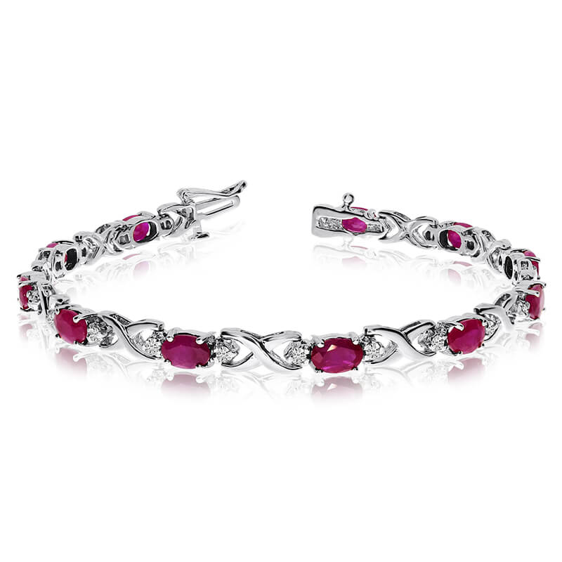 This 14k white gold natural ruby and diamond tennis bracelet features 11 oval rubys with a total ...