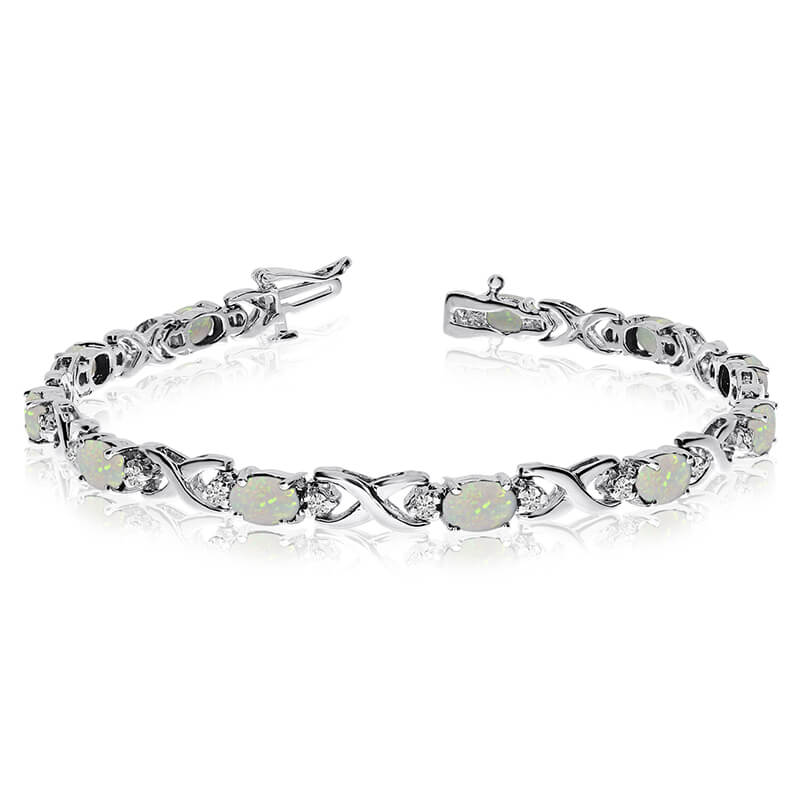 This 14k white gold natural opal and diamond tennis bracelet features 11 oval opals with a total ...