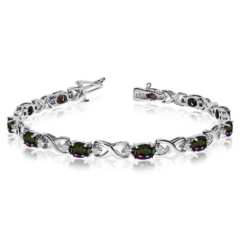 This 14k white gold natural mystic topaz and diamond tennis bracelet features 11 oval all natural...