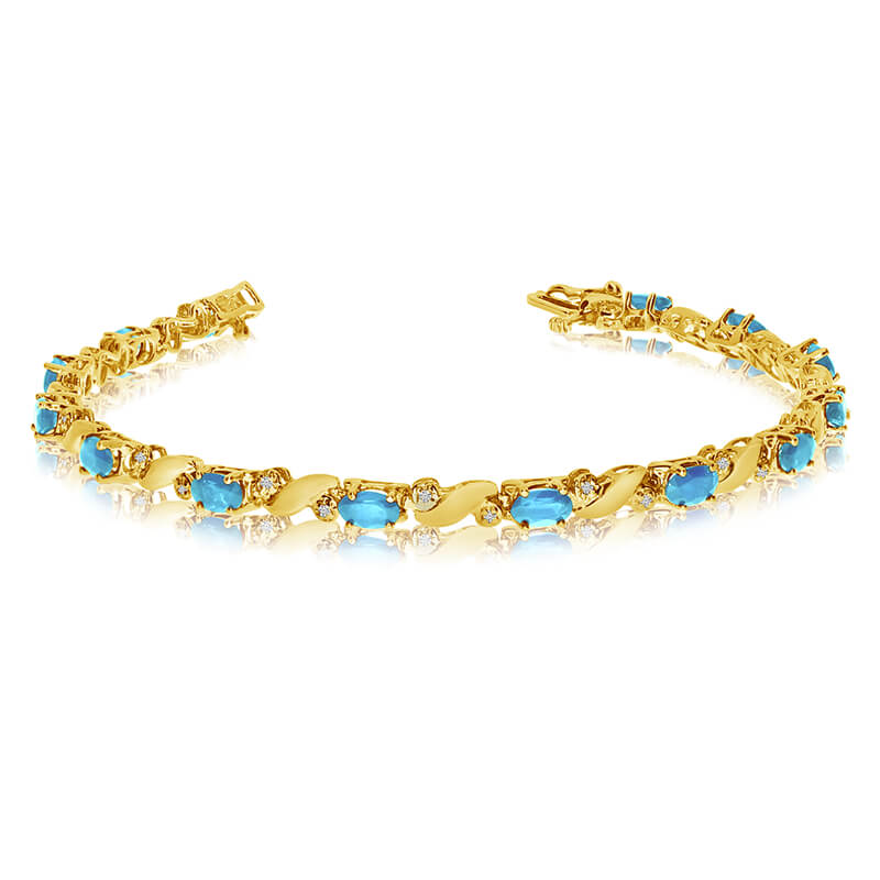 This 14k yellow gold natural aquamarine and diamond tennis bracelet features 13 oval aquamarines ...