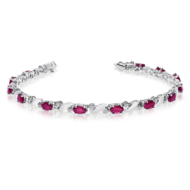 This 14k white gold natural ruby and diamond tennis bracelet features 13 oval rubys with a total ...