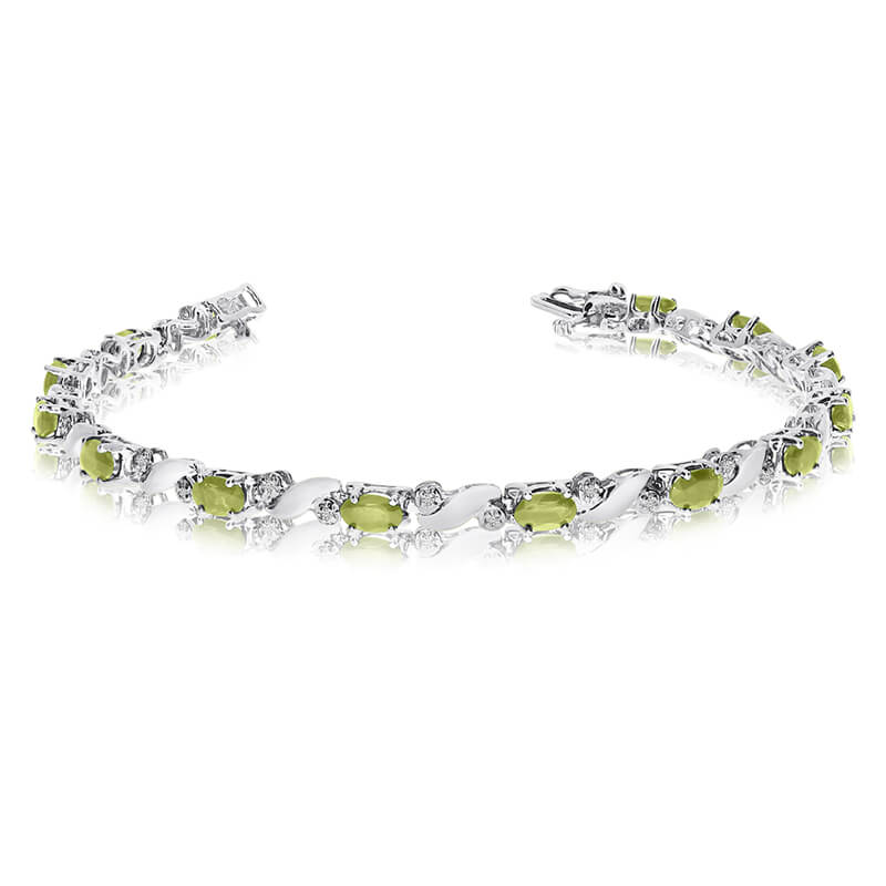 This 14k white gold natural peridot and diamond tennis bracelet features 13 oval peridots with a ...