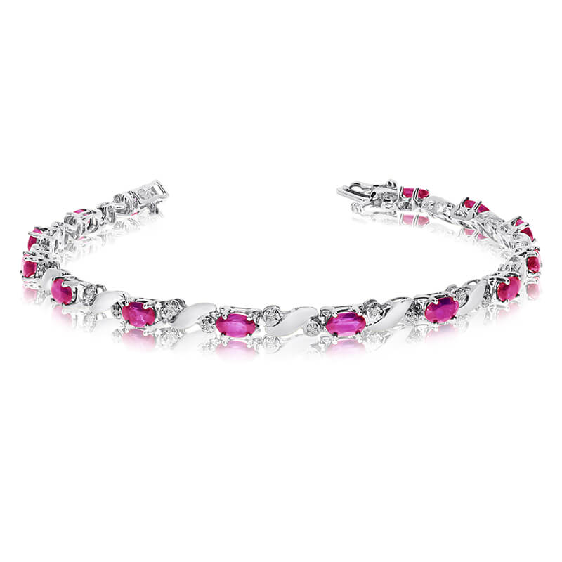 This 14k white gold natural pink-topaz and diamond tennis bracelet features 13 oval pink-topazs w...