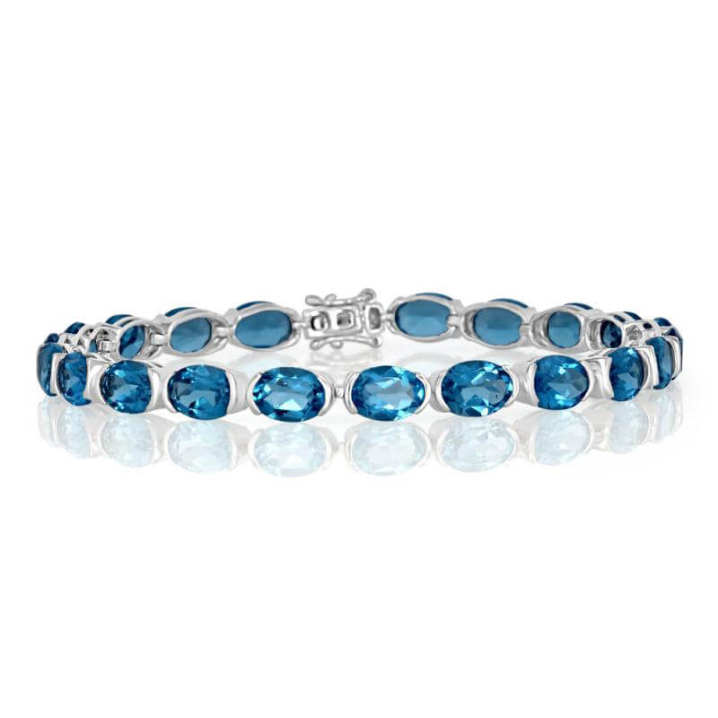 5X7 OVAL BLUE TOPAZ HALF BEZEL BRACELET